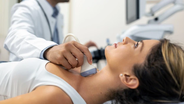 close-up-shot-young-woman-getting-her-neck-examined-by-doctor-using-ultrasound-scanner-modern-clinic.jpg